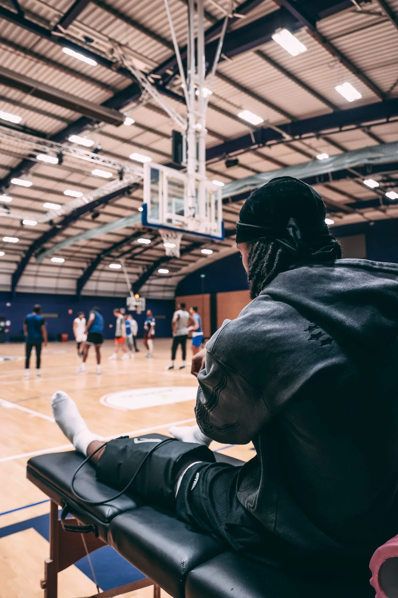 Athlete recovering courtside